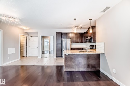 711 5151 Windermere Boulevard, Edmonton, AB - Indoor Photo Showing Kitchen With Double Sink