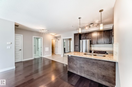 711 5151 Windermere Boulevard, Edmonton, AB - Indoor Photo Showing Kitchen With Stainless Steel Kitchen