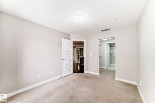711 5151 Windermere Boulevard, Edmonton, AB - Indoor Photo Showing Other Room