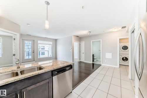 711 5151 Windermere Boulevard, Edmonton, AB - Indoor Photo Showing Kitchen With Double Sink