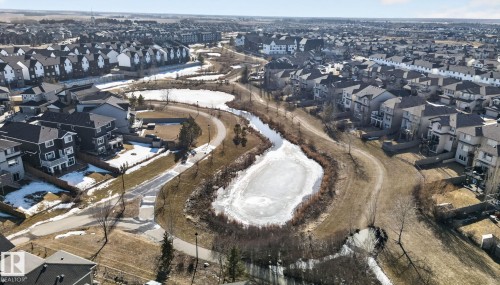 This aerial view showcases the property within a community featuring numerous residential structures - 4134 Charles Link, Edmonton, AB - Outdoor With View