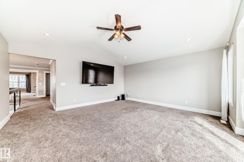 Spacious room with vaulted ceilings, recessed lighting, and a ceiling fan - 4134 Charles Link, Edmonton, AB - Indoor Photo Showing Other Room