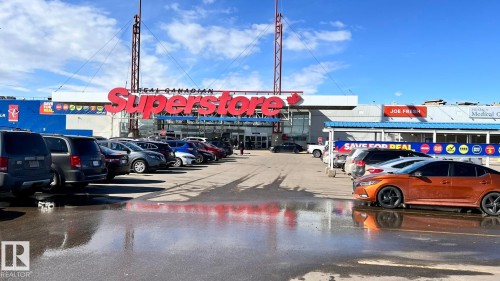 The property is located within a commercial plaza featuring a large retail store and a medical clinic - 1318 330 Clareview Station Drive Nw, Edmonton, AB - Outdoor