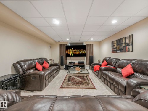 Spacious entertainment area featuring recessed lighting, light-toned walls, and soft carpeting - 1147 Lincoln Crescent, Edmonton, AB - Indoor
