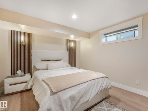 The property features a bedroom with light-colored walls and flooring - 1147 Lincoln Crescent, Edmonton, AB - Indoor Photo Showing Bedroom