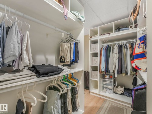 Spacious closet featuring white shelving, hanging rods, and light-colored flooring - 1147 Lincoln Crescent, Edmonton, AB - Indoor With Storage