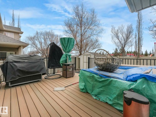 The property features an outdoor deck with a dark railing and a light-colored storage shed - 1147 Lincoln Crescent, Edmonton, AB - Outdoor