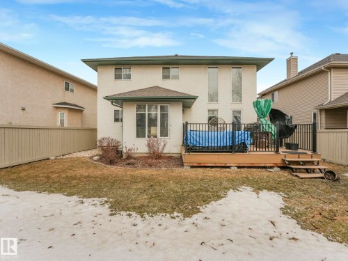 The property features a rear deck with black railings and steps leading to the yard - 1147 Lincoln Crescent, Edmonton, AB - Outdoor