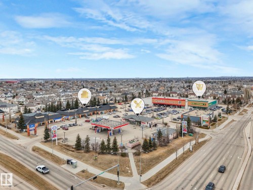 Aerial view of the neighborhood showcasing nearby businesses and residential areas under a clear sky - 1147 Lincoln Crescent, Edmonton, AB - Outdoor With View
