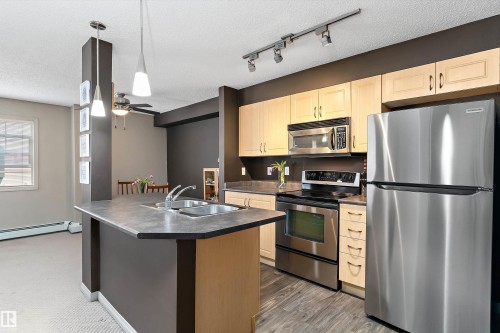 Edmonton, AB - Indoor Photo Showing Kitchen With Stainless Steel Kitchen With Double Sink