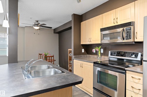 Edmonton, AB - Indoor Photo Showing Kitchen With Stainless Steel Kitchen With Double Sink