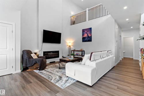 15 Gambel Loop, Spruce Grove, AB - Indoor Photo Showing Other Room With Fireplace