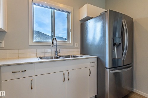 210 Desrochers Boulevard, Edmonton, AB - Indoor Photo Showing Kitchen With Double Sink