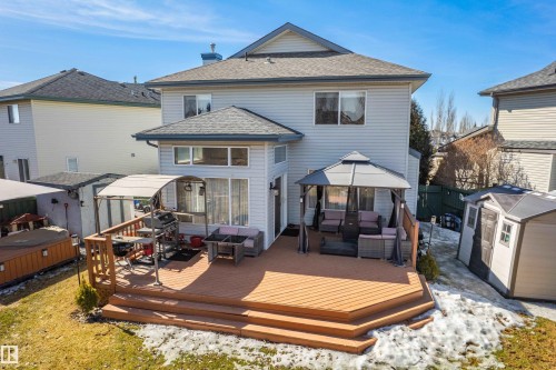 The property features a spacious deck with a light wood finish and tiered steps - 442 Hunters Green, Edmonton, AB - Outdoor With Deck Patio Veranda With Exterior