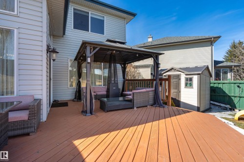 The property features a spacious wooden deck, perfect for outdoor enjoyment - 442 Hunters Green, Edmonton, AB - Outdoor With Deck Patio Veranda With Exterior