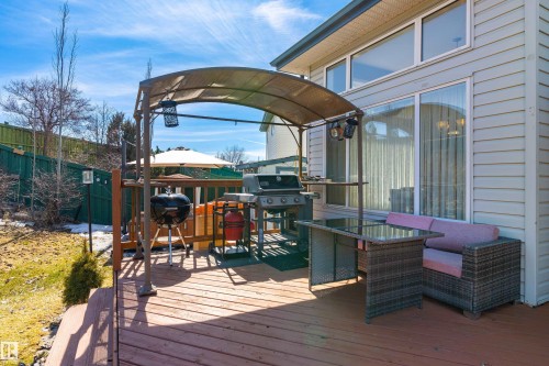 The property features a spacious wooden deck with a gazebo, providing an inviting outdoor living area - 442 Hunters Green, Edmonton, AB - Outdoor With Deck Patio Veranda With Exterior