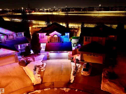 The property features an attached garage with a paved driveway - 442 Hunters Green, Edmonton, AB - Indoor