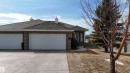 The property features a brick exterior, a driveway, and an attached two-car garage - 6604 Sandin Cove, Edmonton, AB  - Outdoor 