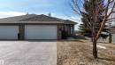 The property features a brick exterior, a driveway, and an attached two-car garage - 6604 Sandin Cove, Edmonton, AB  - Outdoor 