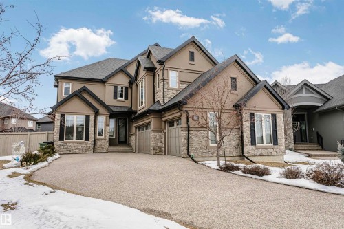 The property features an attractive exterior with a blend of stucco and stone finishes - 3435 Keswick Boulevard, Edmonton, AB 