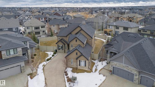 The property features a multi-level design with an attached garage and a paved driveway - 3435 Keswick Boulevard, Edmonton, AB 