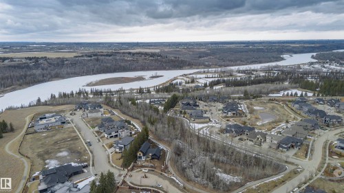 Aerial view of the community, featuring residential properties, roads, and a large body of water - 3435 Keswick Boulevard, Edmonton, AB 