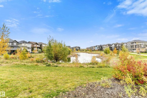 Views of the surrounding community featuring a natural pond, green spaces, and residential properties - 3435 Keswick Boulevard, Edmonton, AB 