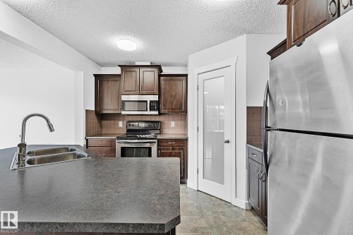 88 14208 36 Street, Edmonton, AB - Indoor Photo Showing Kitchen With Stainless Steel Kitchen With Double Sink