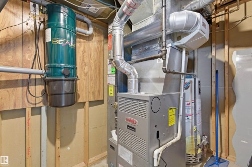 The property includes a central vacuum system, a Lennox furnace, and a water heater - 1707 65 Street, Edmonton, AB - Indoor Photo Showing Basement