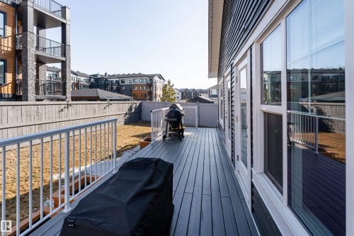The property features a spacious deck with a light-colored railing and a grill - 6193 Carr Road, Edmonton, AB - Outdoor With Exterior