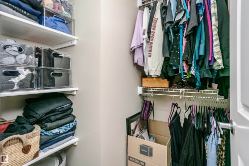 The property features a closet with white shelving and hanging rods - 6116 Rosenthal Way, Edmonton, AB - Indoor With Storage
