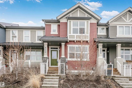 The property features a multi-level facade with horizontal siding and decorative shingle accents - 6116 Rosenthal Way, Edmonton, AB - Outdoor With Facade
