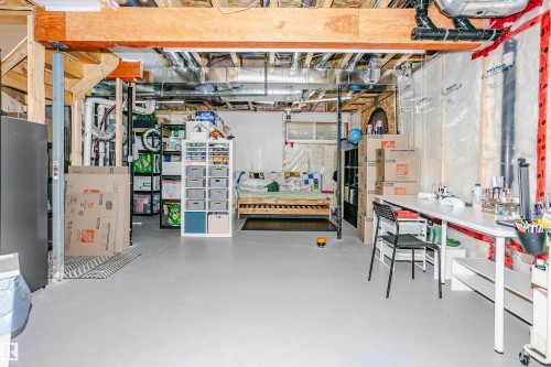 The property features exposed wooden beams and piping, along with concrete flooring - 6116 Rosenthal Way, Edmonton, AB - Indoor Photo Showing Basement