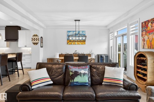 The property features an open-concept living area with light-colored flooring, white walls, and recessed lighting - 345 Meadowview Drive, Fort Saskatchewan, AB - Indoor Photo Showing Living Room
