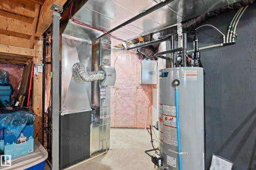 The property includes a water heater and a furnace - 345 Meadowview Drive, Fort Saskatchewan, AB - Indoor Photo Showing Basement