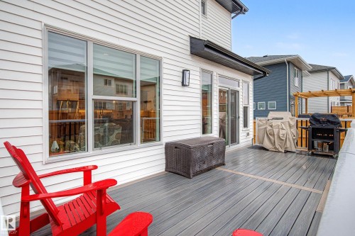 The property features a spacious deck with composite decking, providing an ideal setting for outdoor enjoyment - 345 Meadowview Drive, Fort Saskatchewan, AB - Outdoor With Deck Patio Veranda With Exterior