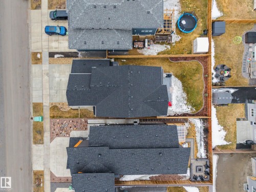 Aerial view showcasing the property's roof with dark shingles and a paved driveway - 345 Meadowview Drive, Fort Saskatchewan, AB - Outdoor With View