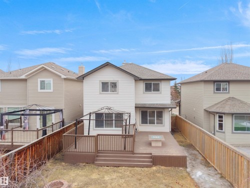 The property includes a spacious backyard with a multi-level deck, a gazebo, and a fire pit feature - 8361 Shaske Crescent, Edmonton, AB - Outdoor With Deck Patio Veranda