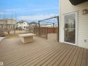 Expansive outdoor deck with a wooden railing and a metal gazebo structure, providing ample space for outdoor enjoyment - 8361 Shaske Crescent, Edmonton, AB  - Outdoor With Deck Patio Veranda With Exterior 