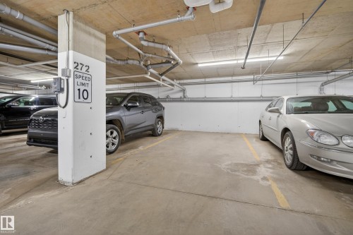 Dedicated parking space with concrete flooring and overhead lighting - 127 1154 Adamson Drive, Edmonton, AB - Indoor Photo Showing Garage