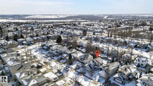 Aerial view of the property and its surrounding residential neighborhood, featuring snow-covered rooftops and bare trees - 19 Escada Close, St. Albert, AB - Outdoor With View
