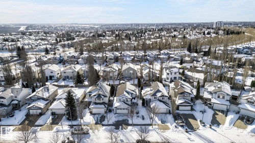 This aerial view showcases a residential neighborhood with numerous properties featuring varied architectural styles and rooflines - 19 Escada Close, St. Albert, AB - Outdoor With View