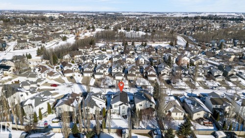Aerial view of the neighborhood showing residential streets and houses with snow-covered roofs and yards - 19 Escada Close, St. Albert, AB - Outdoor With View