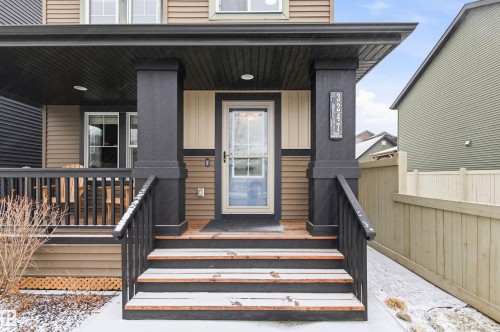 The property features a welcoming front entrance with a covered porch and front steps - 3247 Cherry Crescent, Edmonton, AB - Outdoor With Deck Patio Veranda