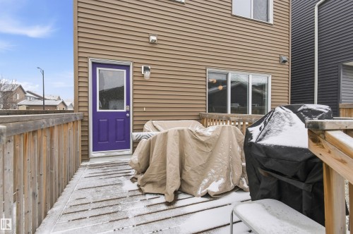The property features a wooden deck with a wooden railing - 3247 Cherry Crescent, Edmonton, AB - Outdoor With Exterior