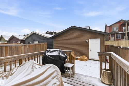 The property features a wooden deck with railing, providing outdoor space - 3247 Cherry Crescent, Edmonton, AB - Outdoor