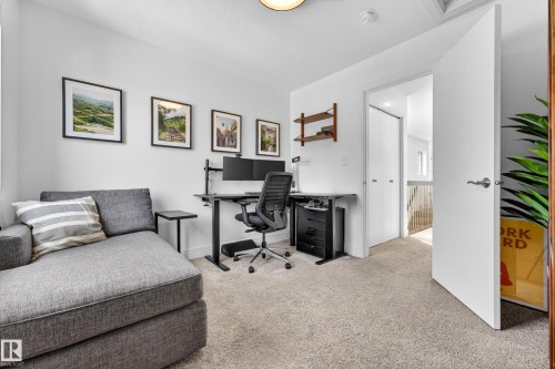 Versatile room featuring light-colored carpeting, white walls, and an open doorway - 7624 91 Avenue, Edmonton, AB - Indoor Photo Showing Office