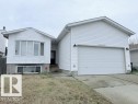 The property features white siding, a prominent two-car garage, and a concrete driveway - 2831 36 Street, Edmonton, AB  - Outdoor 