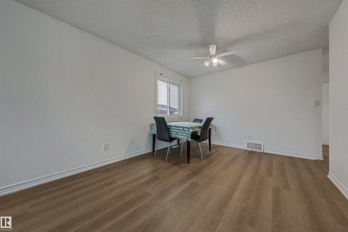 Bright room featuring light-toned flooring, white walls, and a window providing natural light - 2831 36 Street, Edmonton, AB - Indoor Photo Showing Dining Room