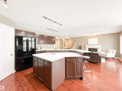 34 Eastgate Way, St. Albert, AB - Indoor Photo Showing Kitchen With Fireplace